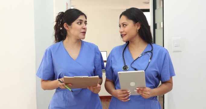 couple of latina women doctors or nurses portrait in a Mexican Hospital in Mexico Latin America. Hispanic healthcare female workers