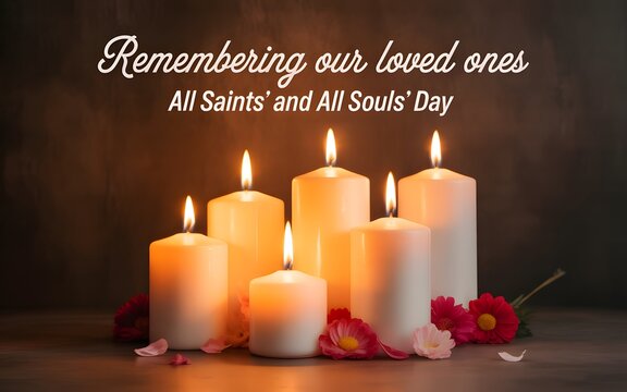 All saints and all souls day memorial candles with flowers on a dark wooden table background