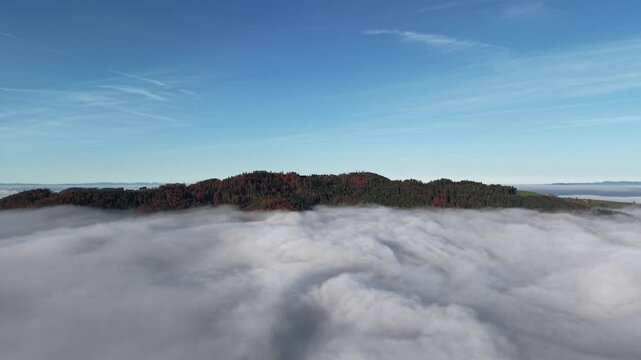 hills and mist at blue sky in Switzerland. Shot on DJI Mavic Air 3s 4K 60fps 150mbit.