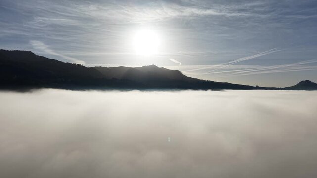 Drone footage with low level sun over the mist. Shot on DJI Mavic Air 3s 4K 60fps 150mbit.