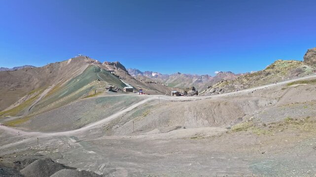 Silvretta mountain ridge, mountain border between Switzerland and Austria, holiday resort in the Alps. Motion right, cable way.