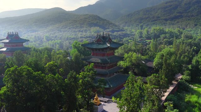 ncient buildings of Shaolin Monastery with flying pigeons at sunrise, sacred landmark of Chinese martial arts cultureShaolin Kung Fu。Chinese civilization，Chinese philosophy