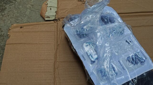 Transparent Blister Bag Filled with Metal Screws and Hardware Fasteners