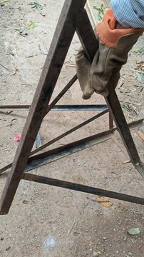 Showing and Dropping Cut Steel Angle Pieces onto Workshop Ground