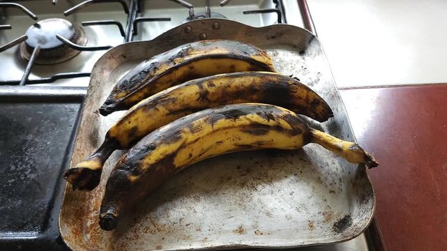 Close Up of Plantains Roasting on Traditional Griddle Comal