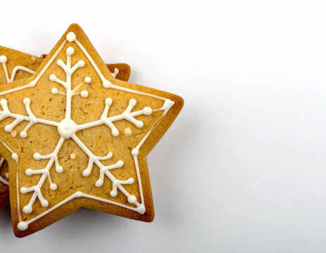Gingerbread cookie snowflake decoration on white background, festive Christmas baking concept with warm holiday atmosphere