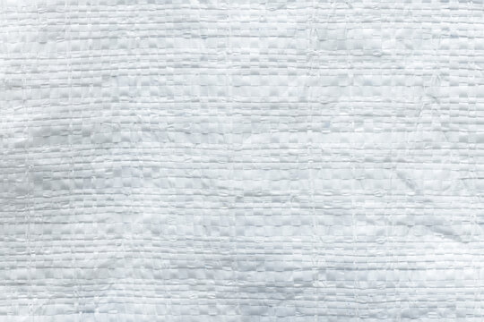 White woven plastic sack texture background, close-up of polypropylene bag material pattern for design and background use,Macro