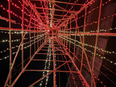 LED light tunnel creating vibrant red and green glow for festive events.