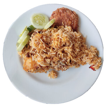 Delicious kacchi fried rice with crispy chicken and fresh cucumber garnish on white plate.