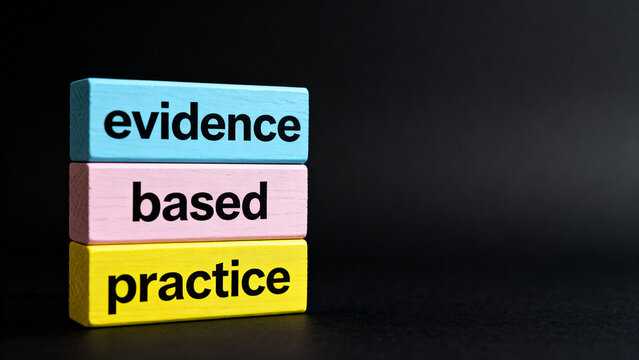 Colorful stacked blocks spelling evidence based practice on dark background