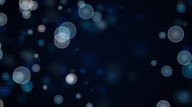 Floating light circles abstract background motion graphic with soft blue bokeh particles moving slowly in dark space for professional video presentation editing.