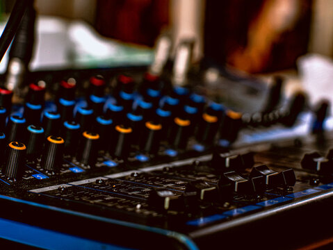 Professional DJ Sound Mixer Panel with Mute Solo Buttons and Sliders Close Up
