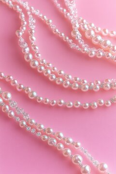 lustrous pearl and crystal necklaces elegantly draped on a soft pink background, evoking romantic luxury and delicate femininity