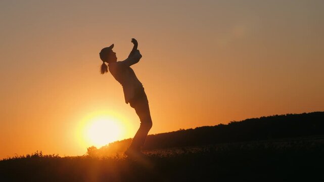 Farmer Dancing in Side-Profile Silhouette at Sunset