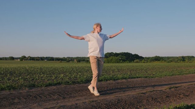 Farmer Dancing Along Field Path in Warm Evening Light