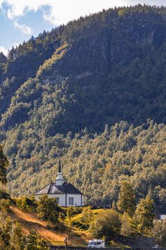 A beautiful white wooden church of Geiranger village in a sunny day. A summer scenery of World Heritage area in Western Norway.