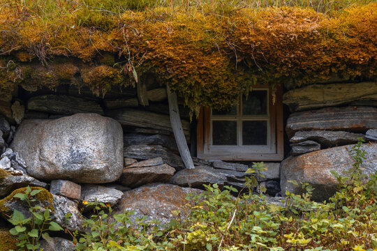 A beautiful traditional mountain farm buildings high on the mountain at the Geiranger village. A summer scenery of World Heritage area in Western Norway.