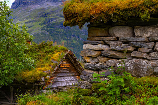 A beautiful traditional mountain farm buildings high on the mountain at the Geiranger village. A summer scenery of World Heritage area in Western Norway.