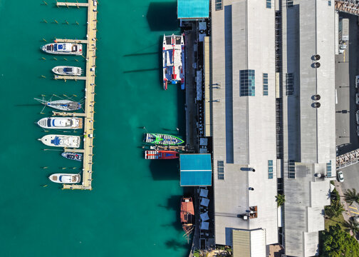Aerial view of boats docked at tropical marina