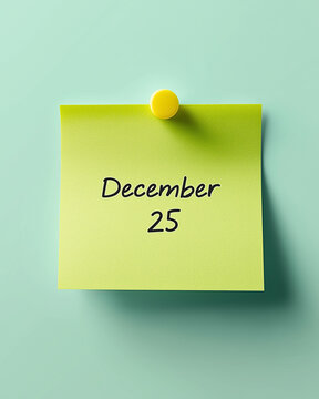 December 25 Reminder: A bright yellow sticky note, pinned to a cool mint background, reads December 25, serving as a simple yet effective reminder of an important date.