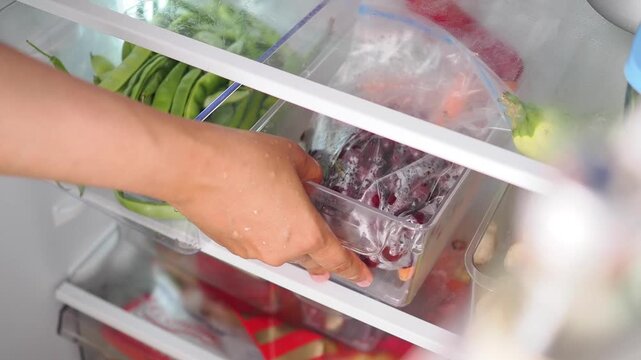 Inside a fridge showing fresh food items