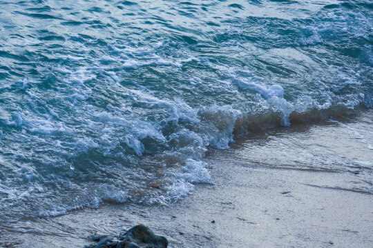 Ocean Waves Breaking on Sandy Beach