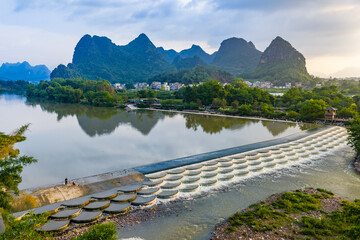 Karst Mountains and Fish Scale Weir on River in Guilin, Guangxi, China © TranAnhDao