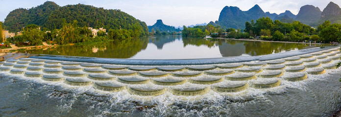 Scenic river and fish scale dam with karst mountains in Guilin, Guangxi, China © TranAnhDao