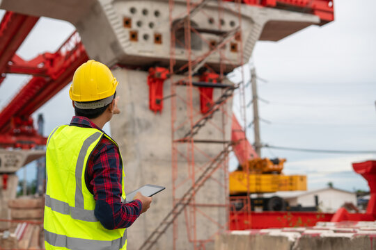 Infrastructure Engineer Monitoring Elevated Bridge Construction Project