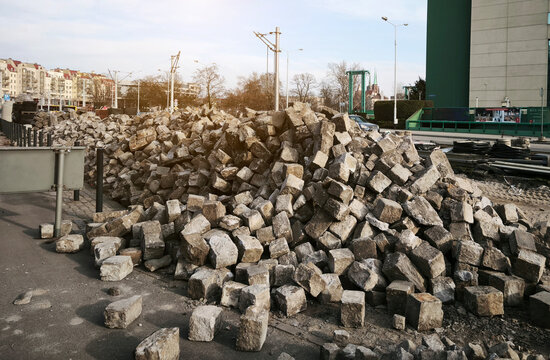 Big construction site. Excavated urban trench with manhole and paved surroundings