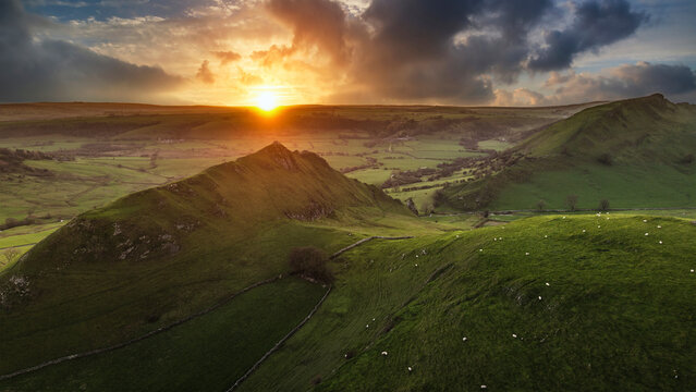 Stunning aerial drone landscape image of Parkhouse and Chrome Hills in Peak Distrcit at sunset durting Autumn Winter