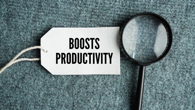 A magnifying glass and a paper tag with the word Boosts Productivity. Placing skilled individuals in the right roles improves efficiency and work quality.
