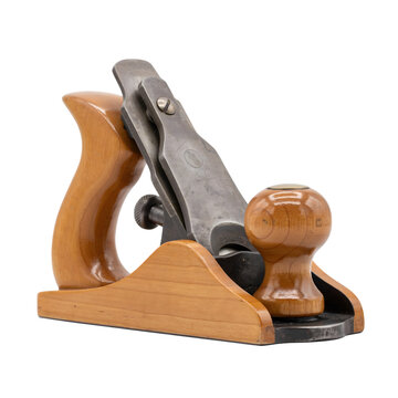 A three-quarter view of a traditional wooden hand plane for woodworking, featuring a polished wooden body and a metal blade, isolated on a black