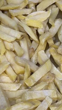 French fries cooking in a deep fryer
