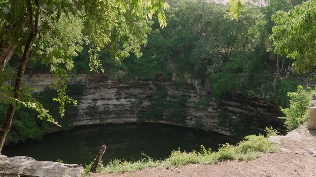 Beautiful outdoor view of a pond called Cenote Xtoloc located at Chicen Itza, Yucatan, Mexico