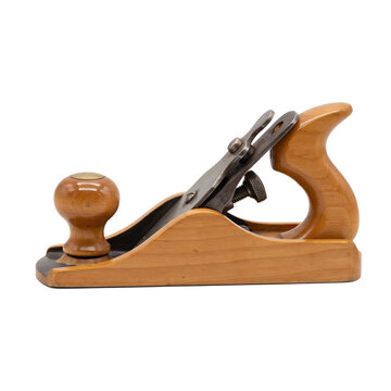A side view of a traditional wooden hand plane for woodworking, featuring a polished wooden body and a metal blade, isolated on a black background