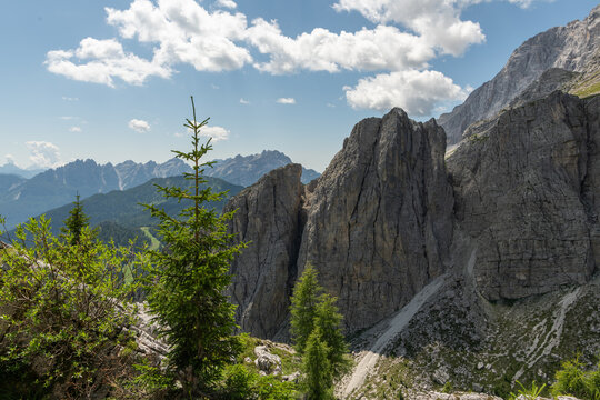 Col dei Baldi, Italy. Dramatic Dolomite cliffs and alpine forest along the trail to Rifugio Sonino al Coldai