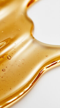 Golden vitamin C beauty serum spreads in smooth glossy waves with tiny air bubbles, luxury skincare macro texture for premium cosmetic advertising.
