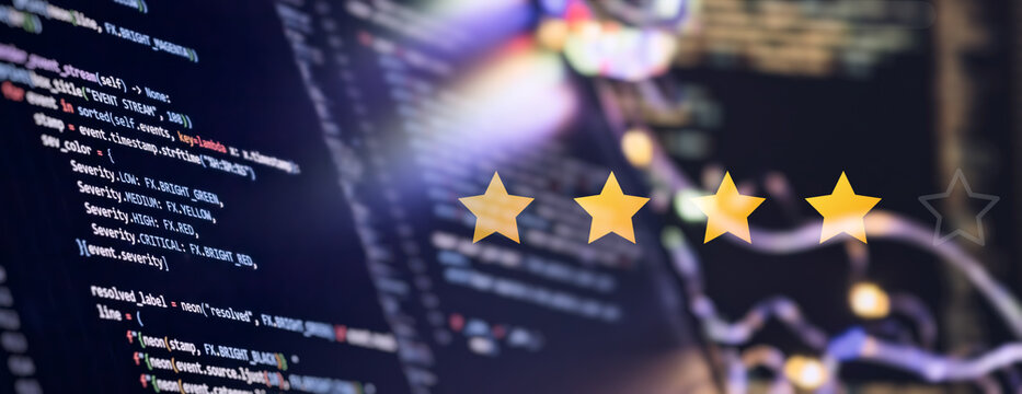Software quality assurance and IT service rating concept. Four golden stars over programming code background, panoramic web banner.