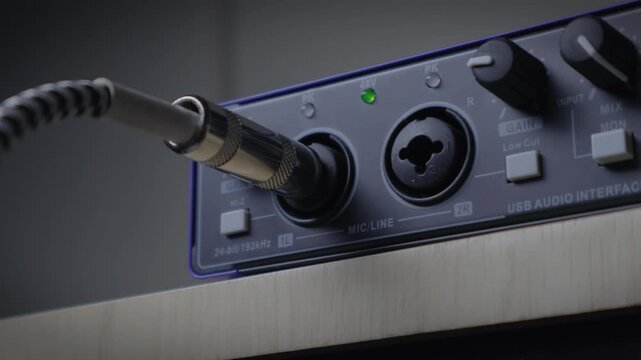 Plugging Instrument Cable into Audio Interface Close-up