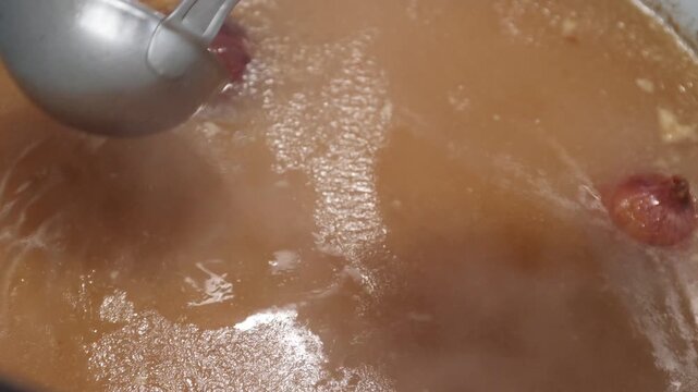 Slow-Simmered Bone Broth in a Home Kitchen Pot - Long, Rich Homemade Stock