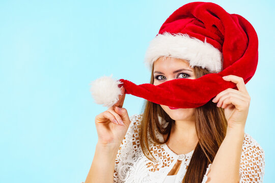 Happy woman in christmas santa hat