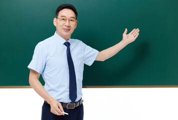 Male teacher presenting at classroom blackboard © KhangSy