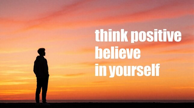 Young man silhouette stands at sunset looking at positive affirmation text. Motivational message about self belief and optimism against colorful sky. Inspiring hope and confidence.