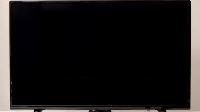 Television screens displaying static during a technological glitch with subtle color distortion across the frame
