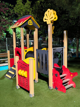 Colorful children playground equipment with slides and climbing frames