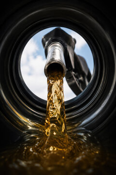 View of  Gasoline Fuel Flowing from Nozzle into Car Tank