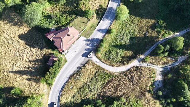 Aerial Top Down View of Camper Van Driving and Pulling Over on Roadside