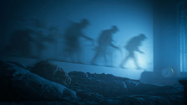 Silhouettes of Dinosaurs Running Under Moonlight.