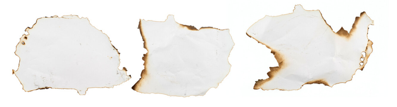 burnt holes in piece of paper isolated on white background.	